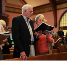 Photo of a couple singing hymns